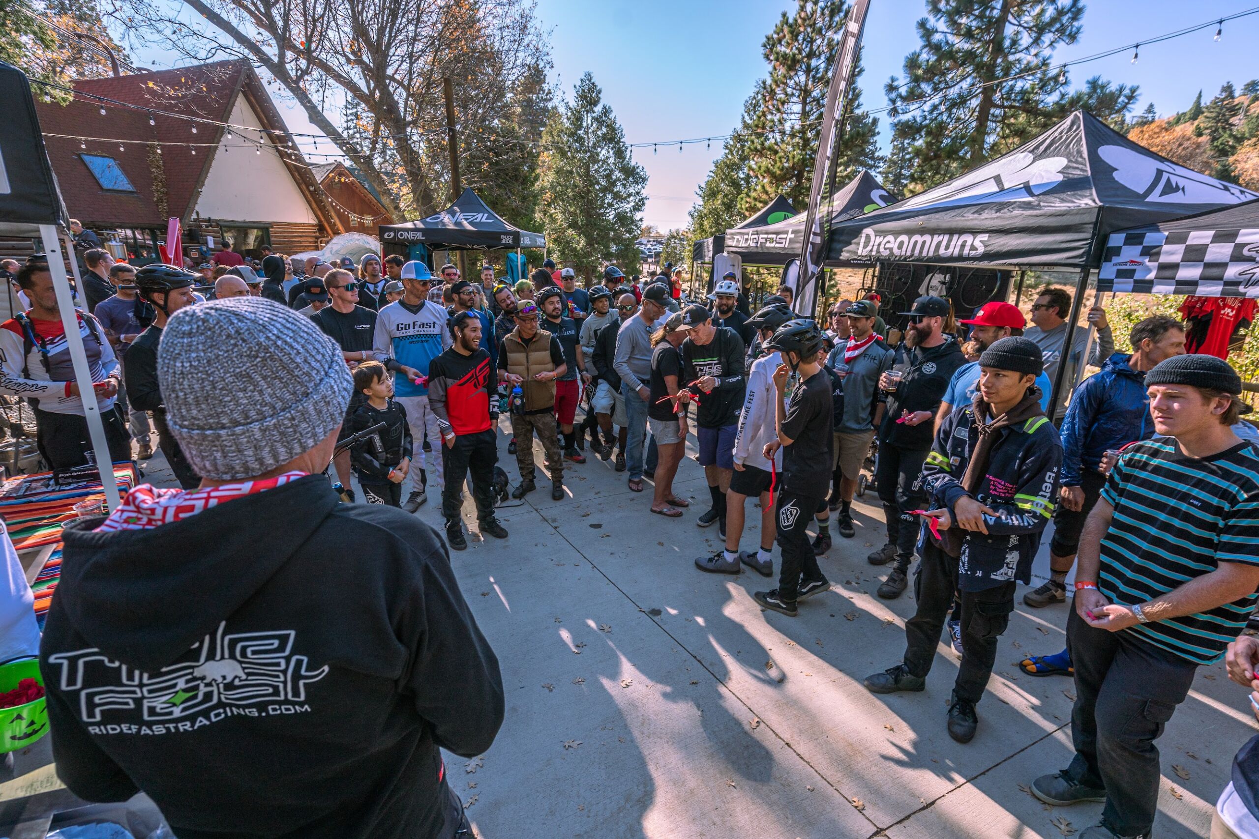 Mountain biker group in front of booths