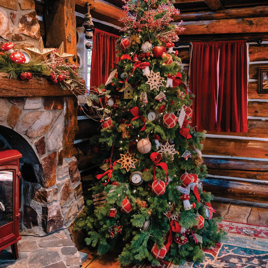 Christmas tree next to a fireplace
