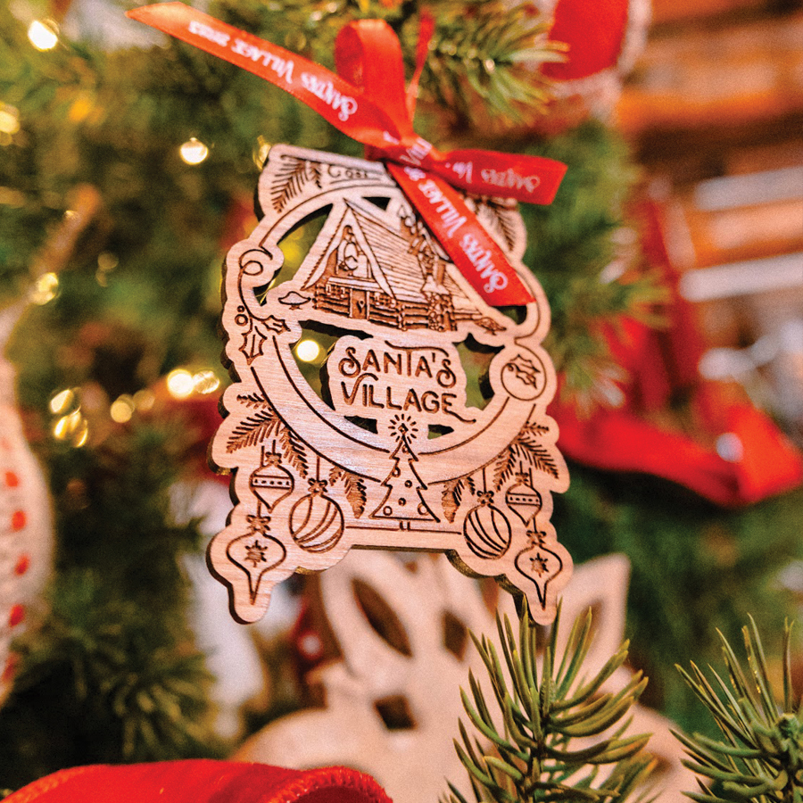 Wooden ornament with a red bow